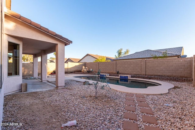 view of yard featuring a patio and a fenced in pool