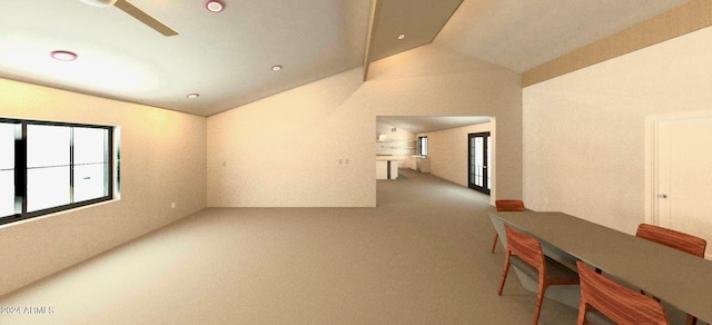 carpeted empty room featuring ceiling fan and lofted ceiling