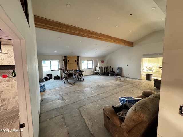 miscellaneous room with lofted ceiling with beams