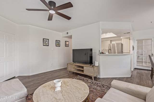 9450 E Becker Ln Unit 1046, Scottsdale, AZ 85260 - living room featuring ceiling fan, dark wood finished floors, and baseboards