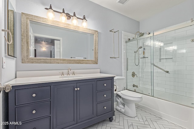 9450 E Becker Ln Unit 1046, Scottsdale, AZ 85260 - bathroom featuring vanity, toilet, and combined bath / shower with glass door