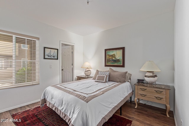 9450 E Becker Ln Unit 1046, Scottsdale, AZ 85260 - bedroom featuring wood finished floors and baseboards