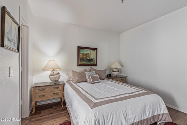 9450 E Becker Ln Unit 1046, Scottsdale, AZ 85260 - bedroom with wood finished floors and baseboards