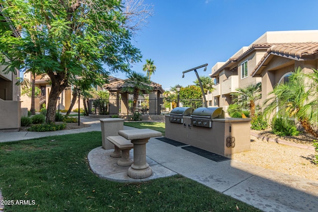 9450 E Becker Ln Unit 1046, Scottsdale, AZ 85260 - view of home's community with an outdoor kitchen and a patio area