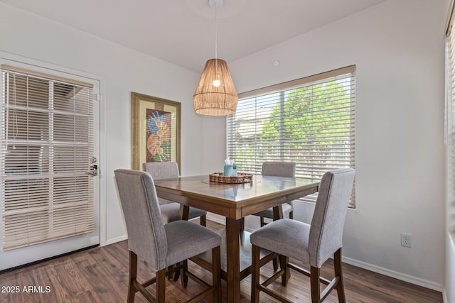 9450 E Becker Ln Unit 1046, Scottsdale, AZ 85260 - dining space featuring dark wood-style flooring and baseboards