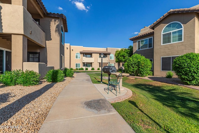 9450 E Becker Ln Unit 1046, Scottsdale, AZ 85260 - surrounding community with a lawn