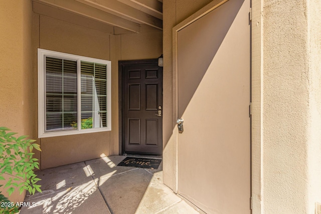 9450 E Becker Ln Unit 1046, Scottsdale, AZ 85260 - doorway to property featuring stucco siding