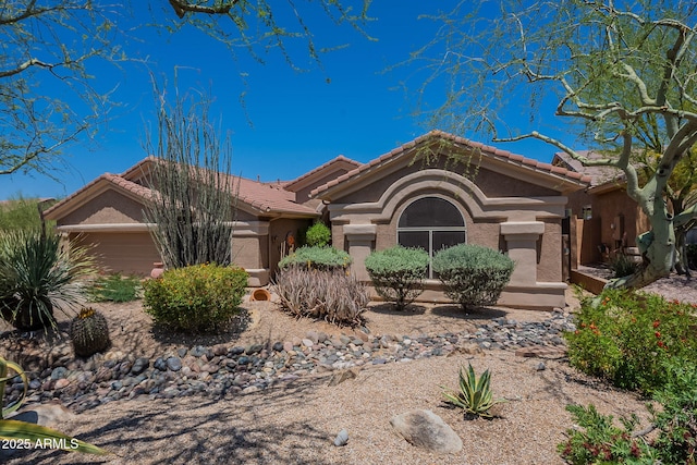 5336 E Gloria Ln, Cave Creek, AZ 85331 - view of front of home featuring an attached garage, stucco siding, and a tiled roof