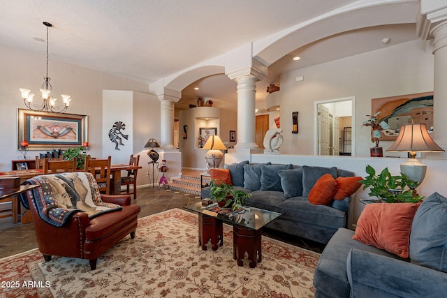 5336 E Gloria Ln, Cave Creek, AZ 85331 - living room with decorative columns, arched walkways, a chandelier, and recessed lighting