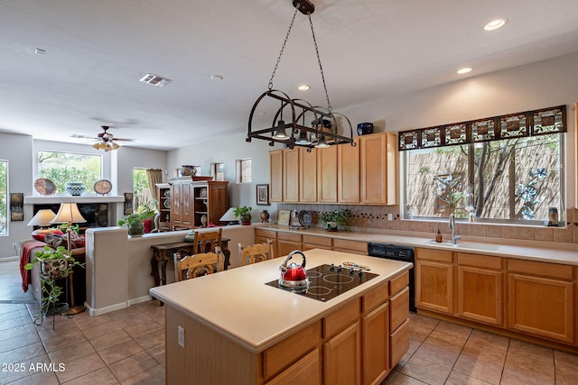 5336 E Gloria Ln, Cave Creek, AZ 85331 - kitchen featuring a sink, black electric cooktop, light countertops, a ceiling fan, and a chandelier