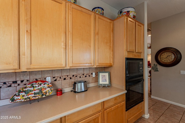 5336 E Gloria Ln, Cave Creek, AZ 85331 - kitchen featuring black appliances, light tile patterned floors, light countertops, tasteful backsplash, and light brown cabinets