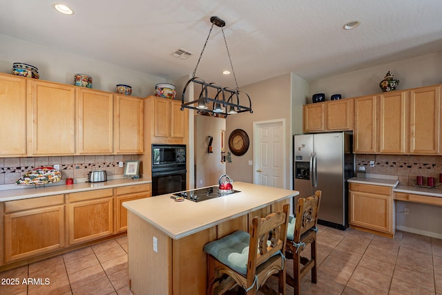 5336 E Gloria Ln, Cave Creek, AZ 85331 - kitchen with black appliances, tasteful backsplash, light tile patterned floors, light countertops, and recessed lighting