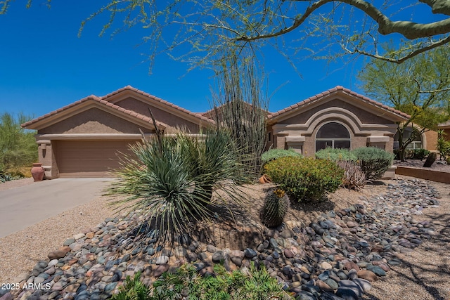 5336 E Gloria Ln, Cave Creek, AZ 85331 - view of front facade featuring a garage, a tile roof, stucco siding, and driveway