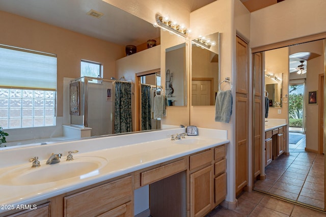 5336 E Gloria Ln, Cave Creek, AZ 85331 - full bathroom with a shower stall, ceiling fan, double vanity, tile patterned floors, and a bath
