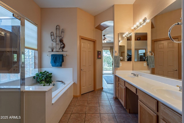 5336 E Gloria Ln, Cave Creek, AZ 85331 - bathroom featuring ceiling fan, a garden tub, double vanity, tile patterned floors, and a shower with shower door