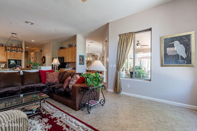 5336 E Gloria Ln, Cave Creek, AZ 85331 - living area featuring baseboards, light tile patterned flooring, and a chandelier