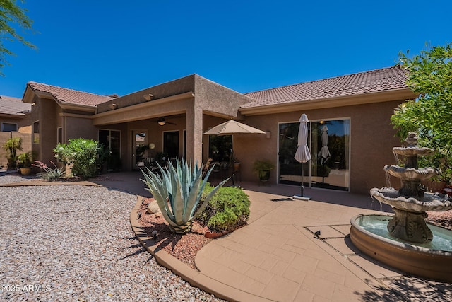 5336 E Gloria Ln, Cave Creek, AZ 85331 - rear view of house with stucco siding, a tile roof, and a patio