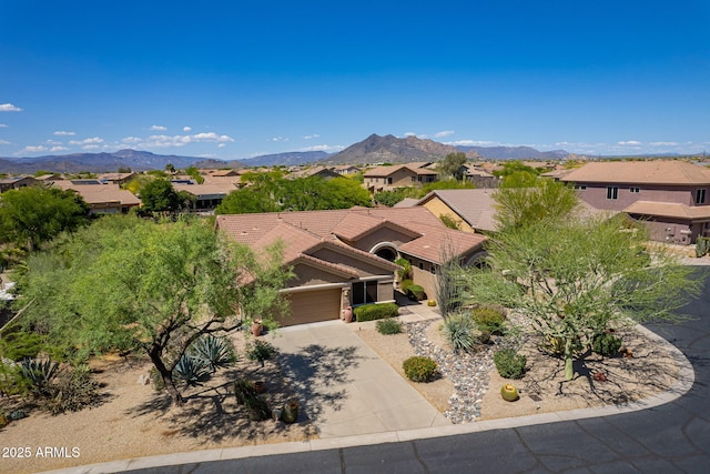 5336 E Gloria Ln, Cave Creek, AZ 85331 - view of front of home with an attached garage, a mountain view, driveway, a residential view, and a tiled roof