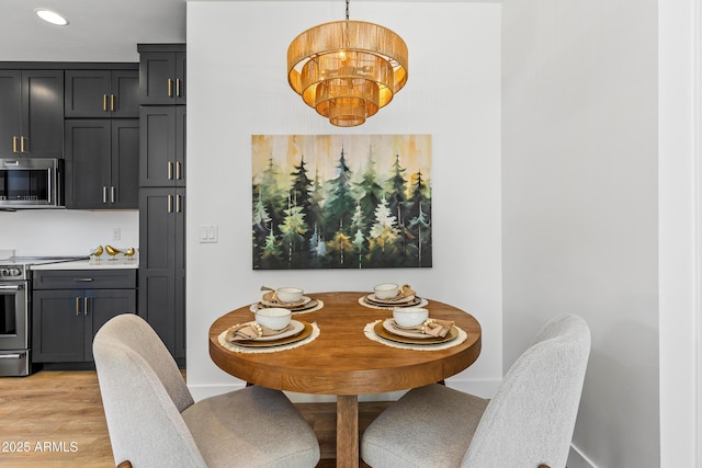 302 W Oak Ave Unit 2, Flagstaff, AZ 86001 - dining room with light wood-type flooring, recessed lighting, and a chandelier