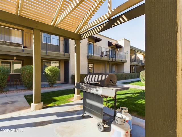 exterior space featuring a pergola and a lawn