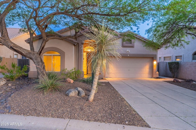 3055 N Red Mtn Unit 122, Mesa, AZ 85207 - mediterranean / spanish house with stucco siding, concrete driveway, a garage, and a tile roof