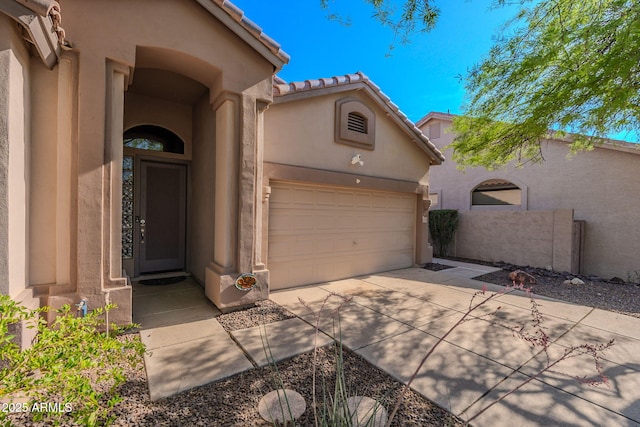 3055 N Red Mtn Unit 122, Mesa, AZ 85207 - view of front facade with concrete driveway, stucco siding, a garage, and a tile roof