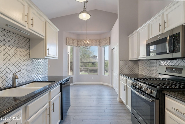 3055 N Red Mtn Unit 122, Mesa, AZ 85207 - kitchen featuring appliances with stainless steel finishes, a sink, a chandelier, white cabinets, and vaulted ceiling