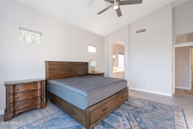 3055 N Red Mtn Unit 122, Mesa, AZ 85207 - bedroom featuring arched walkways, multiple windows, baseboards, and high vaulted ceiling
