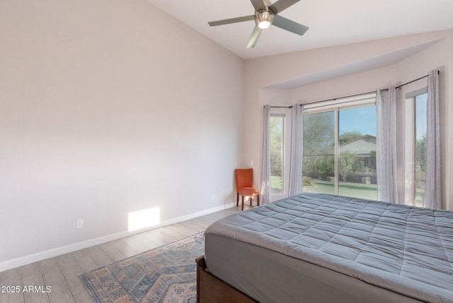 3055 N Red Mtn Unit 122, Mesa, AZ 85207 - bedroom with vaulted ceiling, wood finished floors, baseboards, access to outside, and a ceiling fan