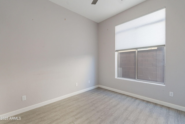 3055 N Red Mtn Unit 122, Mesa, AZ 85207 - empty room featuring wood finished floors, baseboards, and ceiling fan