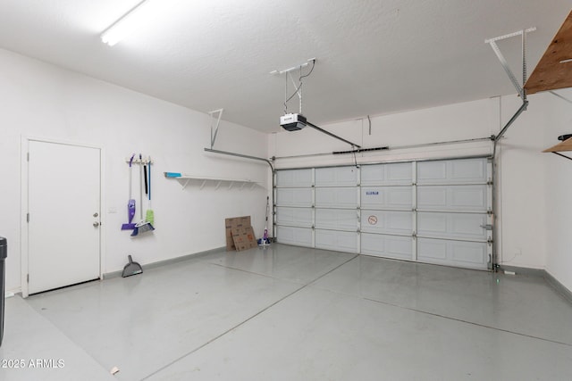 3055 N Red Mtn Unit 122, Mesa, AZ 85207 - garage with a garage door opener and baseboards