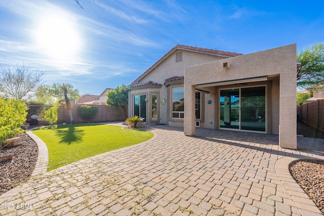 3055 N Red Mtn Unit 122, Mesa, AZ 85207 - rear view of property with stucco siding, a patio area, and a tile roof