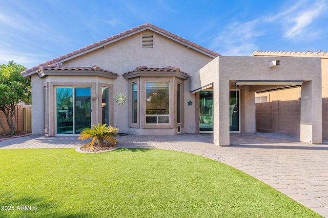 3055 N Red Mtn Unit 122, Mesa, AZ 85207 - back of property featuring a patio, stucco siding, and a tile roof
