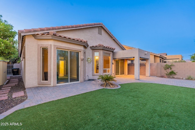 3055 N Red Mtn Unit 122, Mesa, AZ 85207 - rear view of house featuring stucco siding, a patio, and a tiled roof