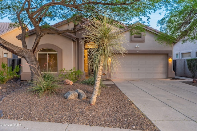 3055 N Red Mtn Unit 122, Mesa, AZ 85207 - mediterranean / spanish-style home with stucco siding, driveway, an attached garage, and a tiled roof