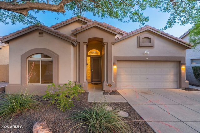 3055 N Red Mtn Unit 122, Mesa, AZ 85207 - mediterranean / spanish-style house featuring stucco siding, driveway, a garage, and a tile roof