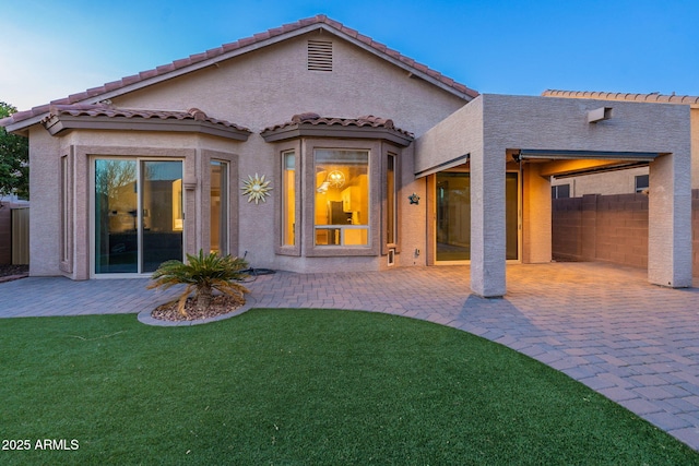 3055 N Red Mtn Unit 122, Mesa, AZ 85207 - back of property with a patio, stucco siding, and a tiled roof
