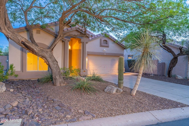 3055 N Red Mtn Unit 122, Mesa, AZ 85207 - view of front of house featuring concrete driveway, stucco siding, an attached garage, and a tile roof
