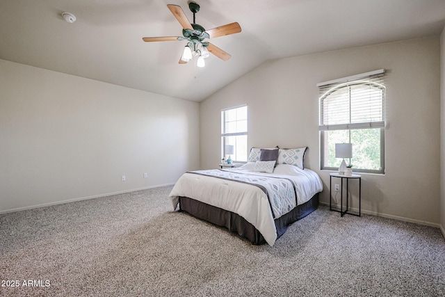 carpeted bedroom with lofted ceiling, a ceiling fan, and baseboards