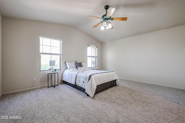 carpeted bedroom with ceiling fan, vaulted ceiling, and baseboards