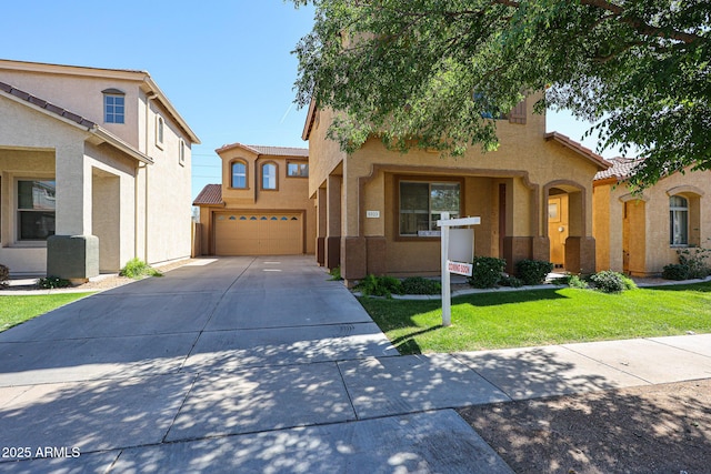 view of front of home with stucco siding, a tile roof, concrete driveway, and a garage