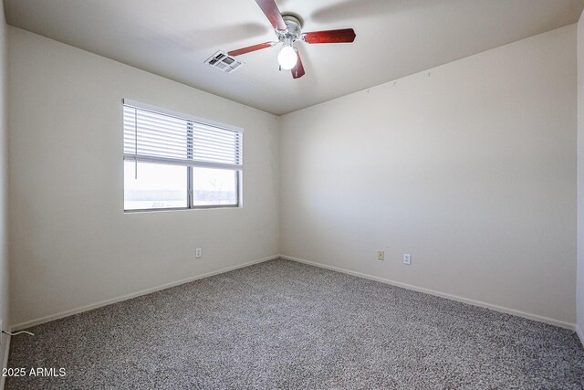 unfurnished room with ceiling fan, baseboards, visible vents, and carpet