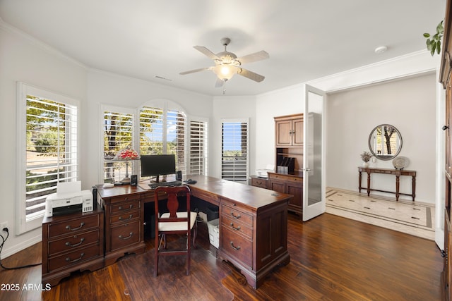 home office featuring dark wood-type flooring, ceiling fan, and crown molding