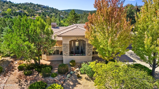 view of front of home featuring a mountain view