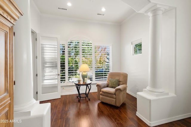 sitting room featuring ornate columns, ornamental molding, and dark hardwood / wood-style floors