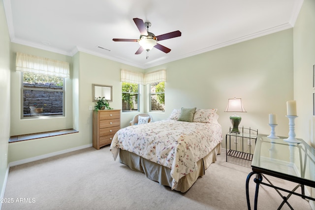 carpeted bedroom with crown molding and ceiling fan