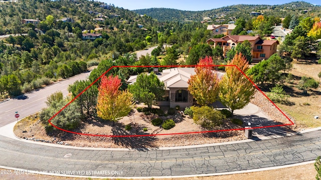 birds eye view of property with a mountain view