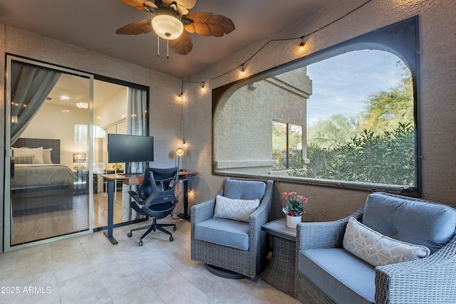 tiled office space with ceiling fan