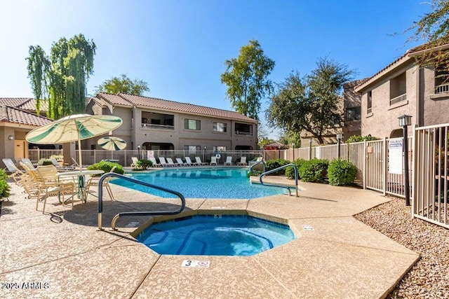 view of pool featuring a community hot tub