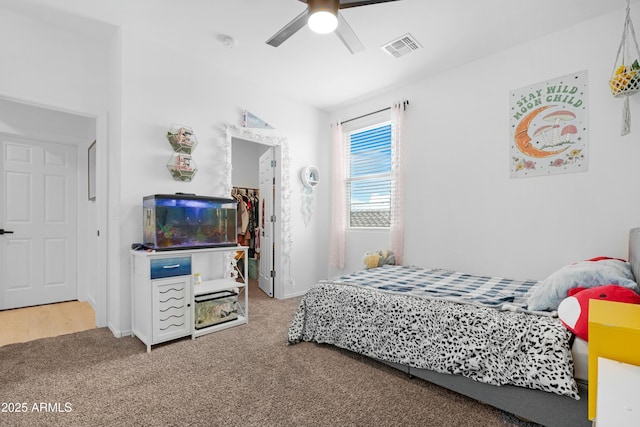 22501 E Indiana Ave, Queen Creek, AZ 85142 - carpeted bedroom with ceiling fan and a spacious closet